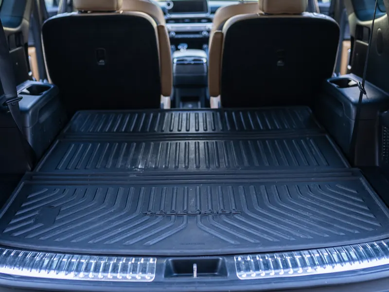 The same cargo area after detailing, liner grooves clean and black