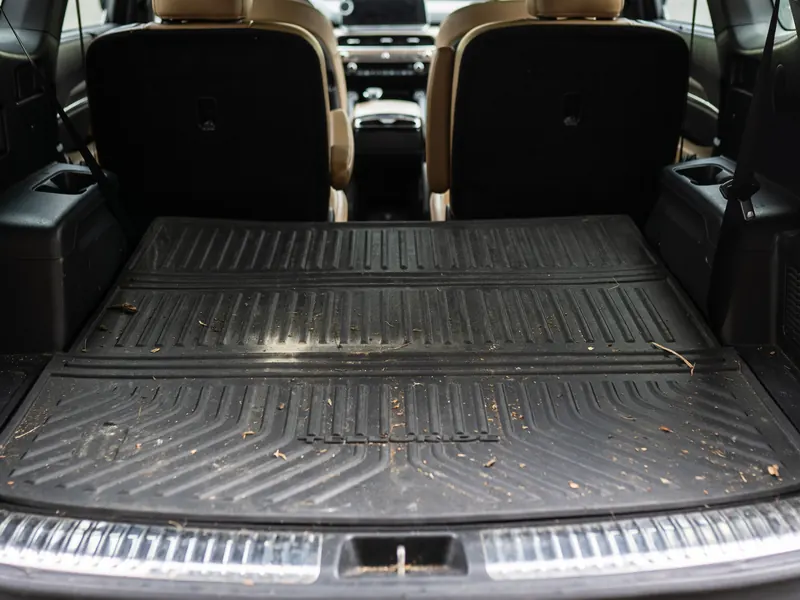 Cargo area before detailing, dirt and debris in the rubber cargo liner grooves