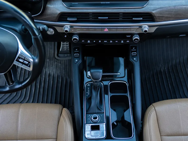 Front console and floor mats after detailing, clean trim and cupholders