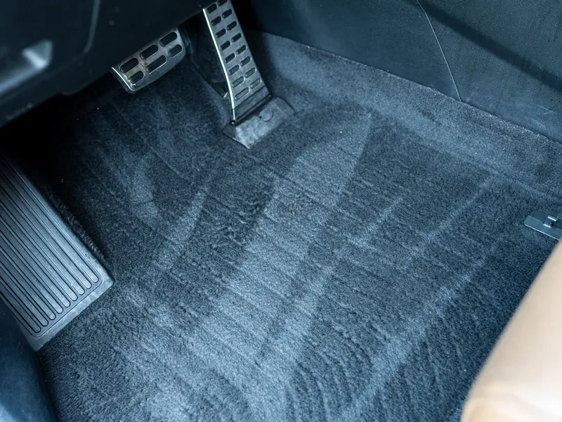 Driver footwell, after. Pedal area and carpet cleaned down to the fibers.