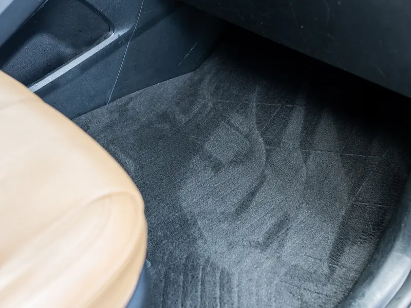 Passenger floor carpet after cleaning with fresh brush lines