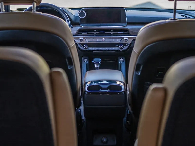 From the second row, after. Clean seatbacks, console and dash looking forward.