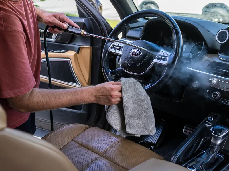 Steering wheel. Steam and a towel on the spokes and buttons, where hands leave the most film.